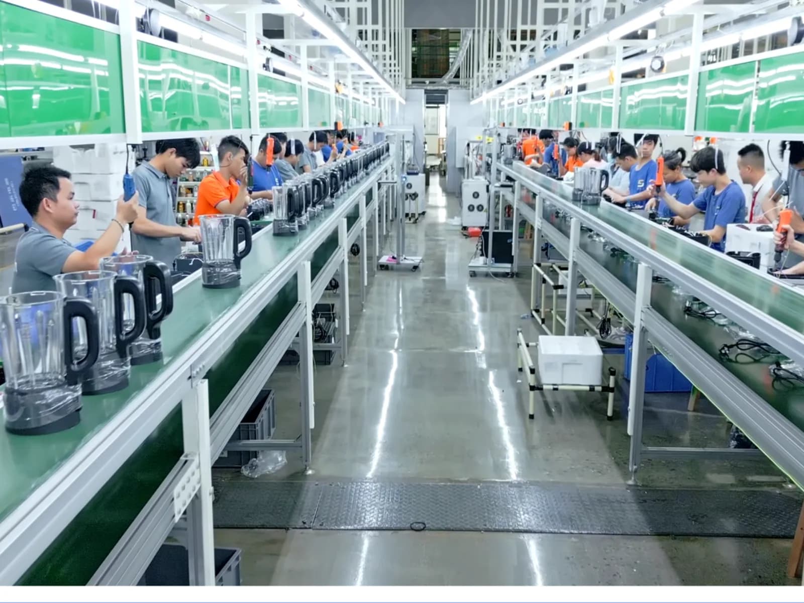 Workers assembling blenders on the production line